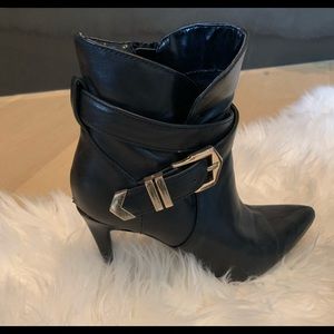 Black ankle booties with Gold buckle